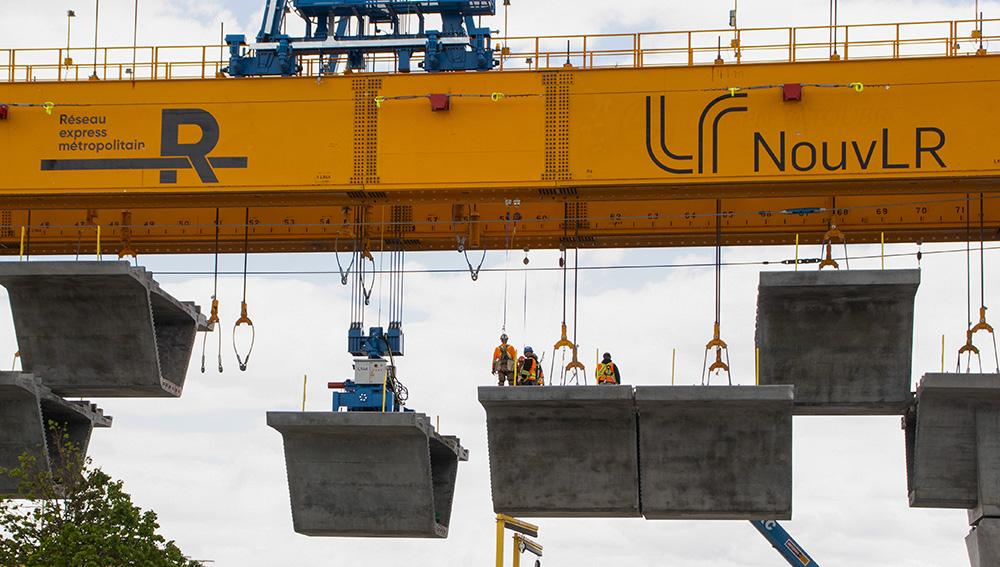 Workers on a launching beam as part of the REM project